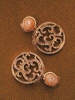 Pair of rose gold oriental earrings