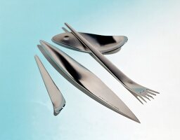 Designer cutlery on blue background