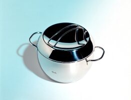 Stainless steel pot on blue background