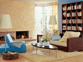 Living room with wicker sofa cushion, shelf, table, lamp and fur carpet