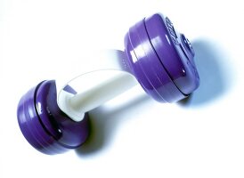 Aerobics dumbbells with interchangeable weight plates on white background
