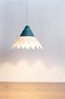 Paper lamp hanging against white background