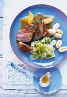 Goose breast with orange sauce, savoy cabbage and gnocchi