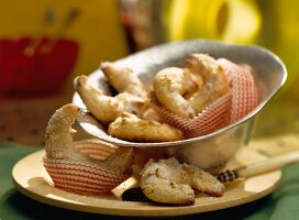 Ginger macadamia crescents on bowl and plate