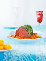 Roast beef with herbs and carrots