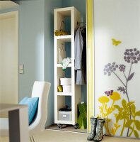 Shelf in alcove with floral pattern wall