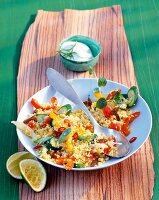 Couscous with vegetables on plate