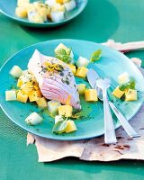 Salmon with turnip and potatoes on plate