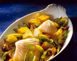 Potato dish with plaice fillets in serving bowl