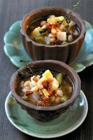 Mediterranean fennel-potato soup with white beans and thyme in bowl