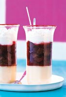 Two rhubarb meringue trifle in glasses on round tray