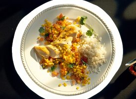 Chicken fillet with lentil chilli salsa on plate