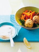 Chickpea balls with carrots in bowl