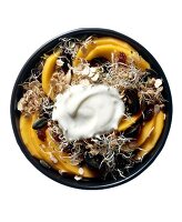 Muesli with mango and yoghurt in bowl