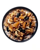 Crunchy oatmeal with apricots in bowl