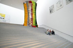 People sitting in Pinakothek der Moderne Museum in Munich, Germany