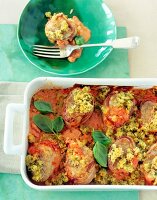 Baked pork in baking tray and bowl