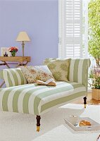 Striped sofa with wheel against purple wall