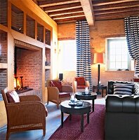 Lounge of hotel with fireplace, chairs and sofa in Orsan near Bourges, France