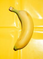 Close-up of banana on yellow background