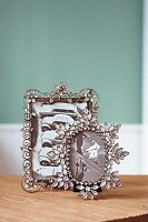 Ornate picture frames made of metal with delicate glass flowers