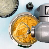 Preparation of apple and almond cake dough with blender, overhead view