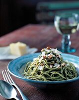 Walnut pesto with spaghetti and parmesan in bowl