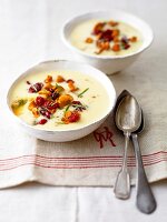 Potato soup with mushrooms and cranberries in bowl