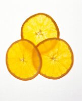 Thin slices of orange on white background