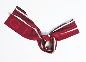 Close-up of striped red scarf on white background
