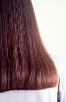 Close-up of long straight brown hair with slightly inward tips