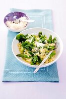 Spinach risotto with asparagus in bowl