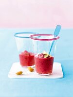 Close-up of two glasses of cherry and banana smoothie