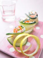 Close-up of zucchini rolls with stuffing and lime twist