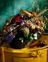 Close-up of basket with dried flowers on table