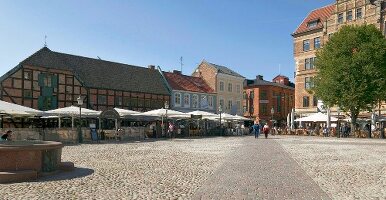 People sitting at cafe in Lilla Torg, Malmo, Sweden