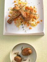 Chicken with fennel, carrots and thyme on a plate