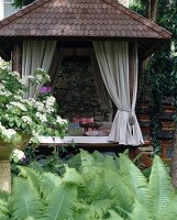 Asian styled relaxation pavilion with roof made of coconut wood