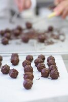 Ready chocolate truffles on parchment paper