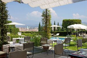 Tables laid on terrace of Onice Restaurant in Florence, Italy