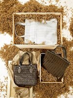 Three handbags in brown and white in wood chips