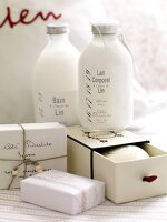 Close-up of white lotions bottles and soap boxes
