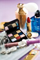 Eye shadow palette, lipstick, powders and perfume