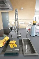 Modern countertop with rectangular sink in kitchen