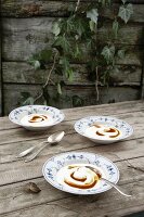 Three dishes of sea buckthorn with quark