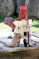 Four boots made of suede leather, red and brown plaid patchwork pattern