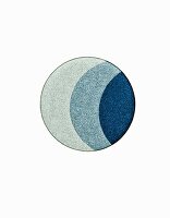 Three different shades of blue eye shadow on white background