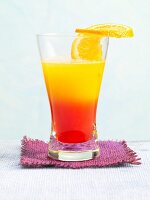 Tequila Winter Sun garnished with a slice of orange