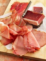 Raw ham, partially sliced