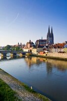 View of Cathedrals and Stone Bridge over Danube river in Regensburg, Germany
